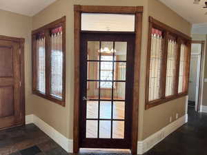 Office/Den inside the foyer, with interior and exterior glass windows