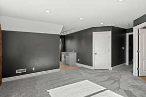 Room that could be used as a bedroom or family room with ensuite bathroom
