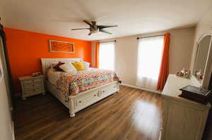 Bedroom with wood finished floors and a ceiling fan