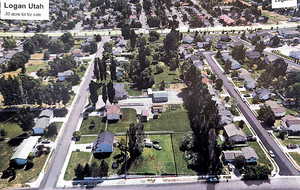 Aerial view of property's location featuring nearby suburban area