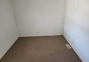Spare room featuring carpet