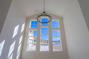 Detailed view of stucco siding and a chandelier