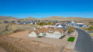 Aerial view of residential area featuring a mountainous background