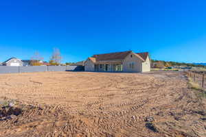 Rear view of property with stucco siding and a patio area