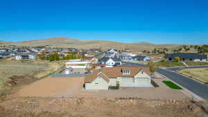 Aerial view of residential area featuring mountains