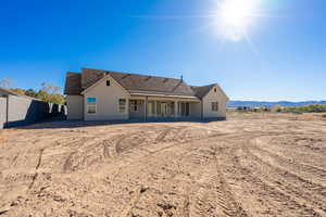 Back of property with a patio area, stucco siding, and a fenced backyard