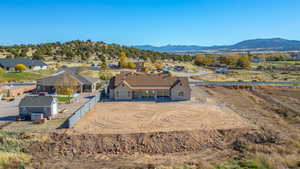 Aerial view of property and surrounding area with mountains