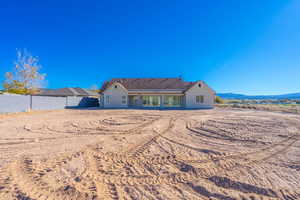 Rear view of property with a patio area and stucco siding