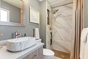 Completely updated bathrooms w/ stylish tile surrounds and modern finishes