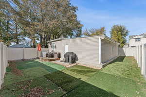 View of outbuilding with a fenced backyard