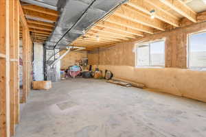 Basement featuring heating unit