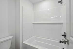 Full bath with tub / shower combination and toilet