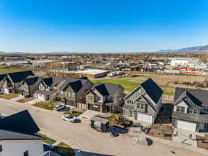 Aerial perspective of suburban area featuring a mountainous background