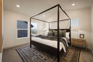 Bedroom featuring dark carpet, vaulted ceiling, and recessed lighting