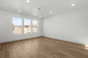 Unfurnished room featuring light wood-type flooring and recessed lighting