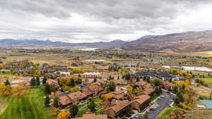 Aerial view of residential area featuring a water and mountain view