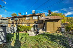 Back of property featuring brick siding