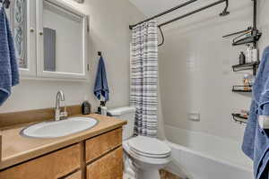 Full bath with vanity and shower / bathtub combination with curtain