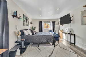 Bedroom featuring light wood-style floors and recessed lighting