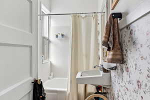 Bathroom featuring shower / bath combo