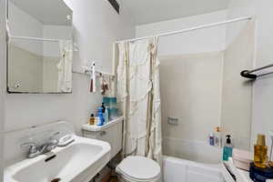 Full bath with shower / bath combo and toilet