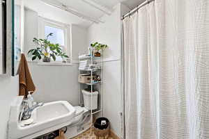 Full bath featuring a shower with curtain
