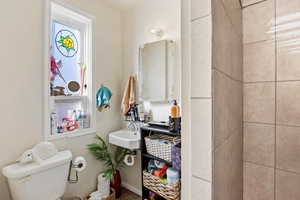 Bathroom featuring toilet and a sink