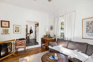 Living room featuring wood finished floors and a ceiling fan