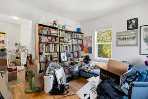 Home office with light wood-style floors