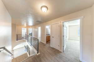 Corridor featuring an upstairs landing