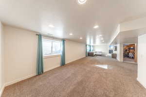 Basement great room with lots of natural light and space for a potential 2nd kitchen or 7th bedroom with large closet