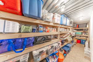 Huge storage space with sturdy custom built shelves