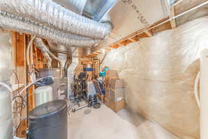 Utility room with extra storage space and included freezer