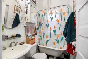 Bathroom featuring a sink and toilet
