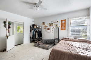 Bedroom with a ceiling fan and hardwood / wood-style flooring