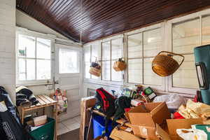 Sunroom / solarium featuring lofted ceiling