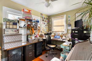 Office with wood finished floors and a ceiling fan