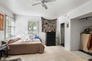 Bedroom featuring a ceiling fan and baseboards