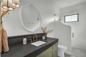 Bathroom with vanity and a shower stall