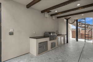 Covered outdoor kitchen, spiral stairs to the slide and jump deck