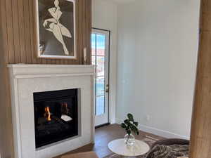 Primary suite fireplace and door to outside oasis