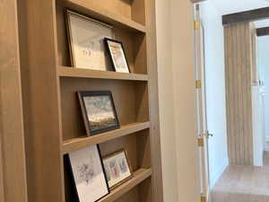 Hidden primary suite behind bookcase door