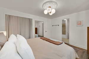 Bedroom featuring baseboards and a closet