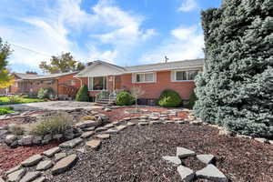 Single story home with brick siding