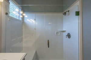 Cultured marble shower with bench