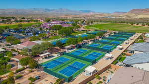 Aerial view of residential area featuring a mountainous background
