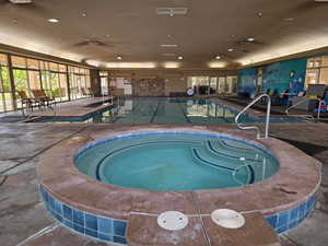 View of indoor pool and hot tub area