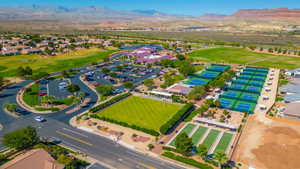 Aerial perspective of suburban area featuring a mountain backdrop