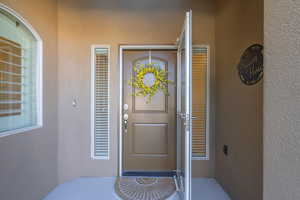 View of exterior entry featuring stucco siding