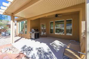 View of patio / terrace with a ceiling fan and area for grilling